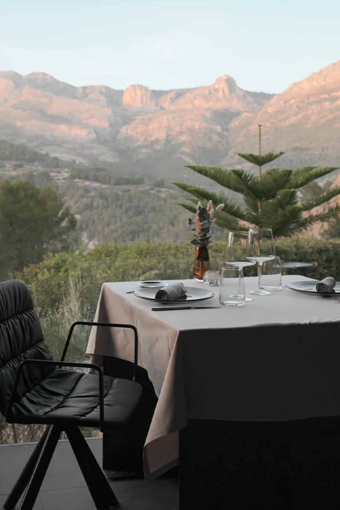 Table set for a romantic dinner at VIVOOD with mountain views